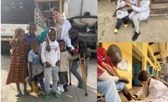 student helping the locals in Ethiopia
