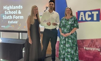 Mr Islam collecting award for secondary school of the year at ACT