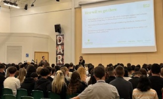 students watching a presentation in the main hall