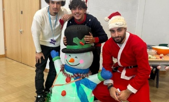 studnets at Highlands Winter Wonderland with snowman